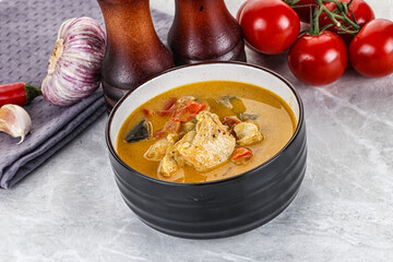 Traditional yellow Thai curry with chicken