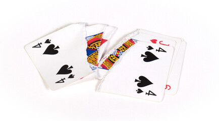 Playing card, torn in pieces