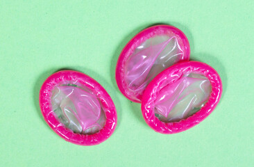 Condoms isolated on solid background - 779426061