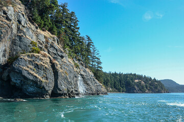 Scenic cliffs along the blue waters of Victoria, BC, Canada
