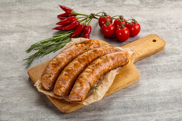 Raw sausages with spices and herbs
