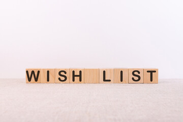 Wish list text on a wooden cubes on a light background