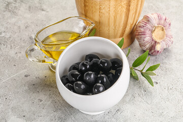 Black olives with oil and branch