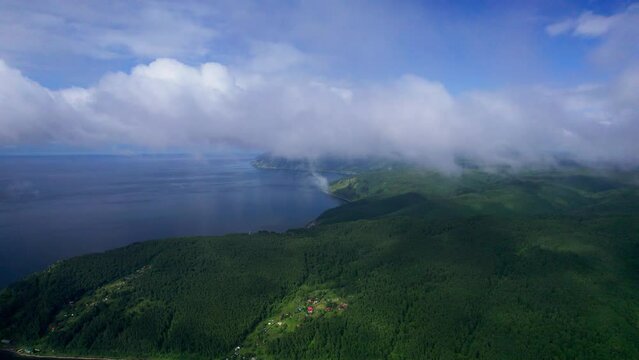 "Capture the breathtaking beauty of Lake Baikal and the Angara River from above in stunning aerial footage. Ships and boats glide through the crystal-clear waters, offering fantastic views.
