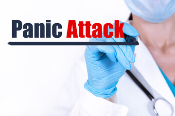 PANIC ATTACK words written by doctor's hand. Mental health healthcare medical concept.