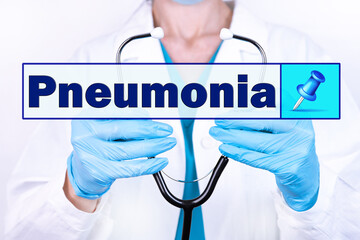 PNEUMONIA text is written on the background of a doctor holding a stethoscope. Medical concept.