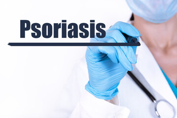 PSORIASIS text is written with a marker held by a doctor with a stethoscope. Medical concept.