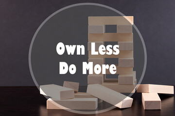 Inspirational Quote on a building background - Own Less do more