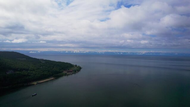 "Capture the breathtaking beauty of Lake Baikal and the Angara River from above in stunning aerial footage. Ships and boats glide through the crystal-clear waters, offering fantastic views.