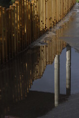 Reflection of a bridge on a pool - 779454439