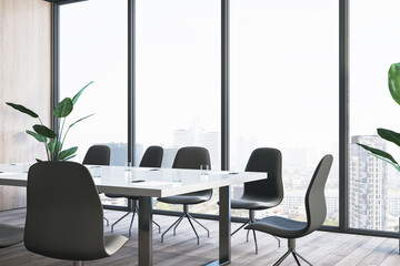 Contemporary glass conference room interior with wooden flooring, furniture and panoramic window...