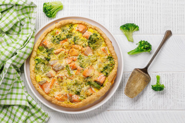 Homemade pie with salmon and broccoli