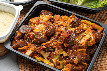 Gopchang, vegetables, stir-fry, sundae, dumplings, fried dumplings, lettuce, radish, ssamjang, pork cutlet, cabbage, chili pepper, garlic, and steamed eggs