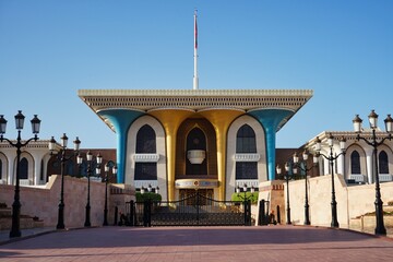 Portrait of the colorful Al Alam Palace, home of Sultan, at sunset in Muscat, Oman