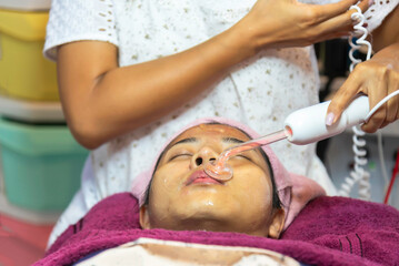 facial treatment with laser and ultrasound in a medical spa center skin rejuvenation concept