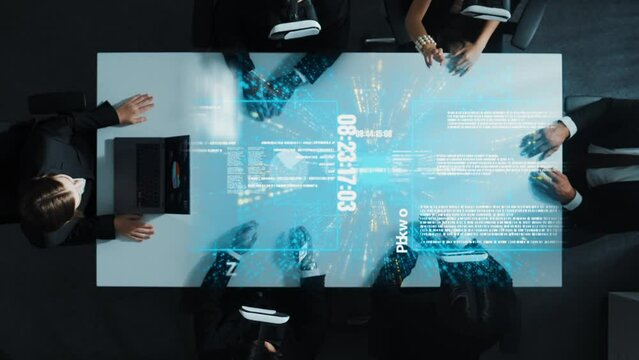Top view of diverse data analysts wearing VR headsets and enter software database while using hand gestures to manipulate programing engineering prompt from the manager laptop. Directorate.
