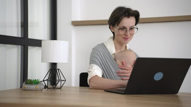Cheerful woman he little son spend free time together at home relaxing on couch with laptop device