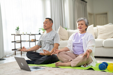 Fototapeta premium Portrait of sport senior asian couple training and sitting relax practicing yoga, elderly health, fitness, exercise, wellness, workout, sport at home.retirement concept.Fitness senior healthy