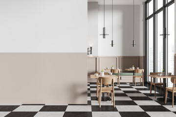 White and beige minimalistic checkered floor cafe interior with sofa and tables, blank wall