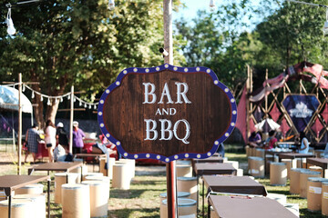 Vintage and retro sign for BBQ or barbecue wooden label in camping area