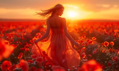Fototapeten Young beautiful woman in poppy field at sunset © Vadim