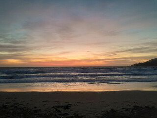 Amazing sunset over sea in Golden Bay Malta.