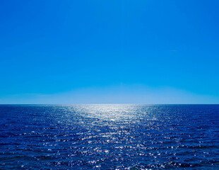 Blue sea and blue sky. Calm sea on a sunny day.
