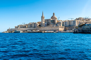 Fototapeta na wymiar Beautiful cityscape with ancient architecture of the Valletta city in Malta. View from the sea