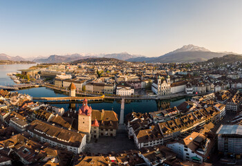 Lucerne, Switzerland: Panoramic view of the Lucerne medieval old town along the Reuss river with the famous Chapel bridge and Mt Pilatus mountain