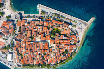 Korcula, Croatia: Top down drone view of the famous Korcula old town and pier by the Adriatic sea...