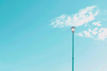 Isolated lamppost against blue sky
