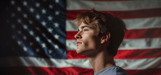 Profile of a thoughtful young man against a vibrant American flag, symbolizing patriotism and contemplation