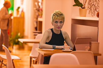 Café turned office, empowered woman works intently