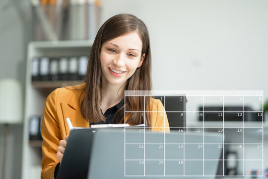 Business woman using digital tablet with calendar planner and organizer to plan and reminder, schedule, timetable, and management, event planning.