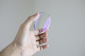 hand holding a magnifying glass