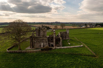 Fototapeta na wymiar Expansive aerial view showcasing Bective Abbey, capturing the entire perimeter fence surrounding the historic site