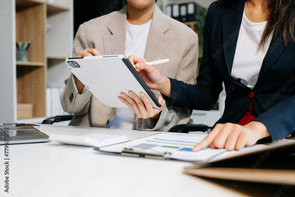 Poster business documents on office table with smart phone and calculator digital tablet and graph business