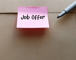 Office envelope with stick note written JOB OFFER -  invitation from employer for potential...