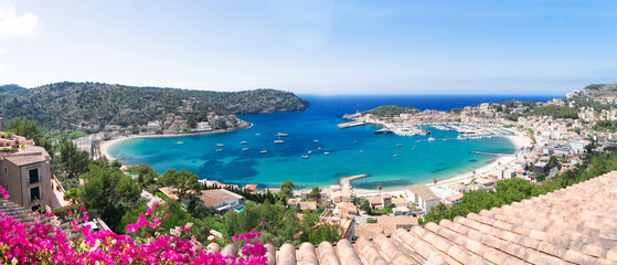 view of Port Soller harbour with house roofs, Mallorca at summer, wide panorama