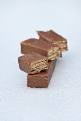 Vertical shot of chocolate wafers isolated on the white background.