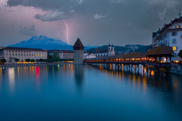 Sunset in historic city center of Lucerne with famous Chapel Bridge and lake Lucerne...