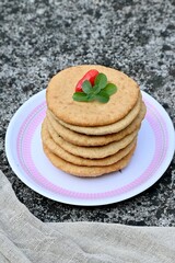 High angle shot of snickerdoodle cookies stacked up in a plate