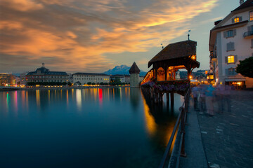 Sunset in historic city center of Lucerne with famous Chapel Bridge and lake Lucerne...
