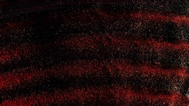 Black wavy surface on which white, red, gold ink flows. An excellent background for websites, movie titles.