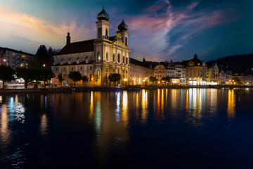 Fototapeta na wymiar Lucerne (Luzern) panorama at night with view of Jesuit church and Reuss River, Switzerland