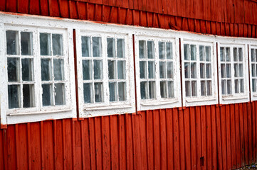 Old small windows on barn close together - obrazy, fototapety, plakaty
