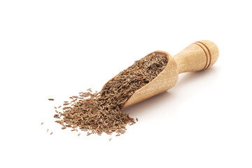 Front view of a wooden scoop filled with Organic Caraway seeds (Carum carvi). Isolated on a white...