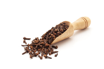 Front view of a wooden scoop filled with Organic Clove (Syzygium aromaticum) or Indian long. Isolated on a white background.
