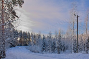 The snow has been plowed from the road in cold winter weather, Loppi, Finland.