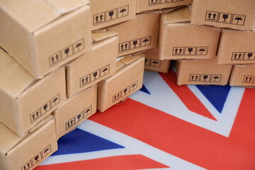 Made in UK concept. British flag and many carton boxes close-up.